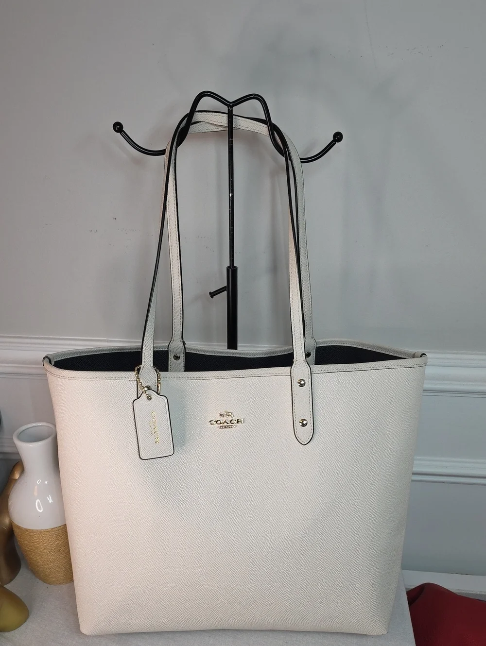 Coach Reversible City Tote crafted in light chalk leather